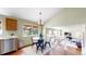 Cozy dining area with modern table set and natural light, open to living space at 4164 E 135Th Pl, Thornton, CO 80241