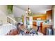 Cozy dining area with modern table set and natural light, open to kitchen at 4164 E 135Th Pl, Thornton, CO 80241