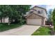 Charming two-story home with a brick facade and well-maintained front yard at 4164 E 135Th Pl, Thornton, CO 80241