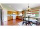 Bright kitchen featuring stainless steel appliances, track lighting, and a large window at 4164 E 135Th Pl, Thornton, CO 80241