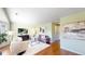 Living room with hardwood floors, plush seating, and stylish decor for a relaxing atmosphere at 4164 E 135Th Pl, Thornton, CO 80241