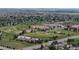 Scenic aerial view of a neighborhood with a sports complex featuring baseball fields, a football field, and tennis courts at 4164 E 135Th Pl, Thornton, CO 80241