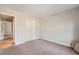Bedroom with closet, plush carpet, and neutral paint at 1367 Teller St, Lakewood, CO 80214