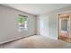 Cozy bedroom with a closet, window, and neutral tones throughout the interior at 1367 Teller St, Lakewood, CO 80214