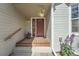 Close-up of the front door showing a classic design, wood accents, and a welcoming entryway at 1367 Teller St, Lakewood, CO 80214