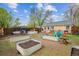 Spacious backyard featuring metal raised garden beds and an outdoor seating area at 2870 Pontiac St, Denver, CO 80207