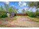 Large backyard featuring a shed, a wooden fence, and plenty of open space at 2870 Pontiac St, Denver, CO 80207