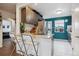 Modern kitchen boasting granite countertops, stainless steel appliances, and stylish, dark wood cabinets at 2870 Pontiac St, Denver, CO 80207