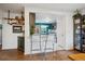 View of modern kitchen featuring a breakfast bar, stainless steel appliances, and sleek countertops at 2870 Pontiac St, Denver, CO 80207