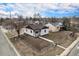 An aerial view of home showing the surrounding neighborhood and newly installed perimeter fence at 2 S Knox Ct, Denver, CO 80219