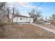 View of home backyard with rock walkway and freshly tilled yard space ready for customization at 2 S Knox Ct, Denver, CO 80219