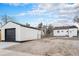 A fenced backyard featuring a detached garage at 2 S Knox Ct, Denver, CO 80219