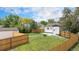 Expansive backyard with a wood fence, gravel pathway, and access to a storage shed at 2 S Knox Ct, Denver, CO 80219