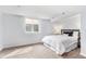 Basement bedroom featuring a queen-sized bed and window with natural light at 2 S Knox Ct, Denver, CO 80219
