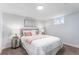 Cozy bedroom with neutral tones, complemented by plush carpeting and soft lighting at 2 S Knox Ct, Denver, CO 80219
