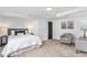 Basement bedroom featuring plush carpeting, a cozy chair, and neutral decor at 2 S Knox Ct, Denver, CO 80219