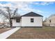 An updated exterior showcasing home facade with sidewalk and freshly landscaped yard space at 2 S Knox Ct, Denver, CO 80219