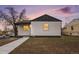 View of home exterior showing repainted facade, walkway, and recently landscaped front yard at 2 S Knox Ct, Denver, CO 80219
