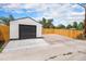 Garage with a large black door and parking available at 2 S Knox Ct, Denver, CO 80219