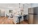 Bright living area with an open layout showcasing a large kitchen island at 2 S Knox Ct, Denver, CO 80219