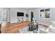 Living room featuring hard wood floors and comfortable seating near large windows at 2 S Knox Ct, Denver, CO 80219