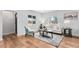 Bright living room with hardwood floors, stylish decor, and ample natural light at 2 S Knox Ct, Denver, CO 80219