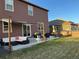 Spacious backyard featuring a concrete patio and seating area, perfect for outdoor gatherings at 975 Alta St, Lochbuie, CO 80603