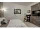 Well-lit bedroom with plush carpeting and neutral color scheme at 975 Alta St, Lochbuie, CO 80603