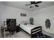 Comfortable bedroom features a single bed, ceiling fan, and ample closet space at 975 Alta St, Lochbuie, CO 80603