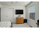 Bright bedroom with a window and large closet at 975 Alta St, Lochbuie, CO 80603
