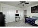 Well-lit bedroom with sliding closet doors and access to an additional room at 975 Alta St, Lochbuie, CO 80603