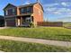 Beautiful two-story home with a well-maintained lawn, a two-car garage and stylish details at 975 Alta St, Lochbuie, CO 80603