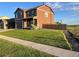Charming two-story home with landscaped yard, wood fence, and covered front porch at 975 Alta St, Lochbuie, CO 80603
