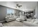 Bright, open living area flows to the kitchen, complete with comfortable seating and lots of natural light at 975 Alta St, Lochbuie, CO 80603