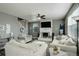 Spacious living room with lots of comfortable seating and a fireplace as its focal point at 975 Alta St, Lochbuie, CO 80603