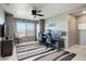 Large, brightly lit office area with two computer desks and plush carpeting at 975 Alta St, Lochbuie, CO 80603