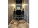 Chic vanity area with Hollywood style lighting and a stylish chair at 975 Alta St, Lochbuie, CO 80603