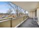 Balcony view showcasing railing with an air conditioning unit and street view at 4600 E Asbury Cir # 210, Denver, CO 80222