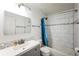 Updated bathroom showcasing a shower/tub combo with subway tile and gray vanity at 4600 E Asbury Cir # 210, Denver, CO 80222