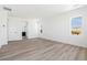 Bright and spacious bedroom with view into the bathroom and modern flooring at 39441 Stockton Cir, Elizabeth, CO 80107