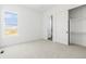 Cozy bedroom with closet and view into en suite bathroom at 39441 Stockton Cir, Elizabeth, CO 80107