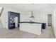 Bright kitchen features white cabinets, gray countertops, and stainless steel appliances at 39441 Stockton Cir, Elizabeth, CO 80107