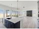 Bright open floorplan kitchen with stainless steel appliances, view to great room and access to deck at 39441 Stockton Cir, Elizabeth, CO 80107