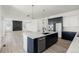 Kitchen island view into the great room with fireplace at 39441 Stockton Cir, Elizabeth, CO 80107