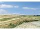 Vast open land featuring grassland and clear blue skies in a serene and beautiful area at 39441 Stockton Cir, Elizabeth, CO 80107