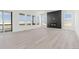 Bright living room features expansive windows, sleek fireplace, and modern floors at 39441 Stockton Cir, Elizabeth, CO 80107