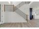 Modern staircase with wood and metal railing, bright natural light at 39441 Stockton Cir, Elizabeth, CO 80107