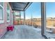 Cozy covered back patio featuring a pink bench and expansive views of the surrounding community at 11063 Shining Star Cir, Parker, CO 80134