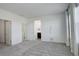 Spacious bedroom with carpet flooring, access to the bathroom, and closet at 11063 Shining Star Cir, Parker, CO 80134