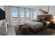 Bright bedroom with large windows, a comfortable bed, and stylish decor at 11063 Shining Star Cir, Parker, CO 80134